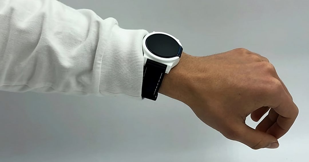 The smartwatch worn on a wrist